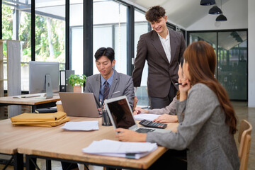 Young business team working together in a modern office.