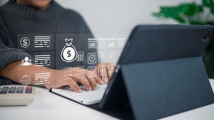 Businessman using tablet with digital finance and fintech icons for online banking and investment technology