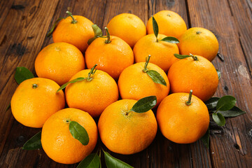 Fresh Mandarin Oranges with Leaves on Wooden Background - Citrus Fruit Display