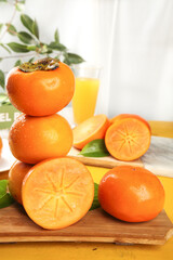Fresh Shanxi Persimmons on White Background - Rich Orange Sweet Crisp Asian Fruit Display