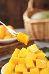 Fresh Ripe Mango Chunks on Fork - Tropical Fruit Pieces Ready to Eat