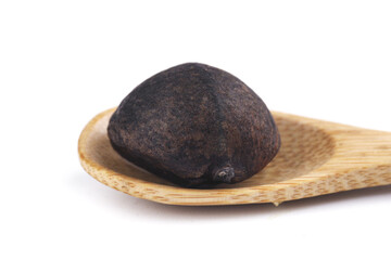Traditional Dark Fermented Tea Cake on Wooden Plate - Pu-erh Tea Origin Product