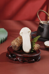 Fresh Matsutake Mushrooms on Traditional Wooden Plate with Tea Service