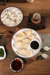 Traditional Handmade Spanish Mackerel Seafood Dumplings with Soy Sauce on Wooden Table
