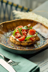 Bruschetta with cherry tomatoes and basil on toast
