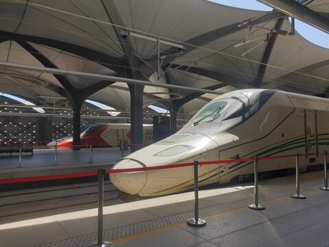 Aerial view of railway Speed Train to Mecca at Madinah Al-Munawwarah station with blurred background. Transportation photography concept design. Haramain High Speed Railway HHR