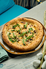 pizza with arugula and mushrooms