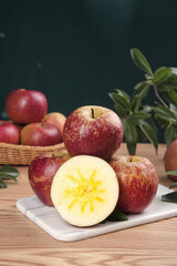 Fresh Red Apples from Xinjiang Yanyuan with Yellow Star Pattern on Wooden Board
