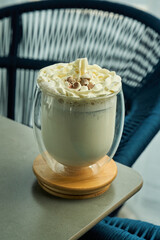 White hot chocolate with cream topping