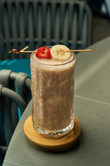 Strawberry and banana garnish on smoothie