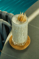 Three white garnish leaves on smoothie