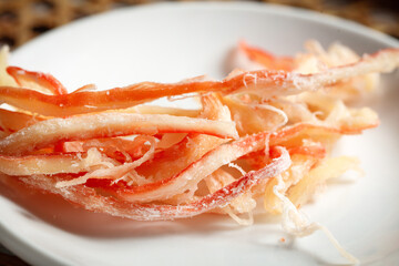 Grilled Squid Strips Seafood Specialty Appetizer on White Plate