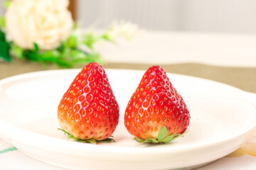 Fresh Red Dandong Strawberries Cut in Half on White Plate - Sweet Fragrant Fruit