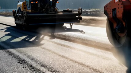 Road construction machinery laying asphalt. Heavy equipment resurfacing street. Industrial paving process with steam and dust. Urban infrastructure improvement.