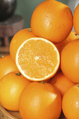 Fresh Orange Citrus Fruits with Half Cut Showing Juicy Interior