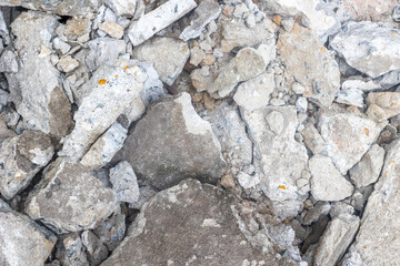 Close-up of roughly textured concrete rubble and rocks
