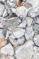 Close-up of cracked concrete rubble surface texture with rough edges