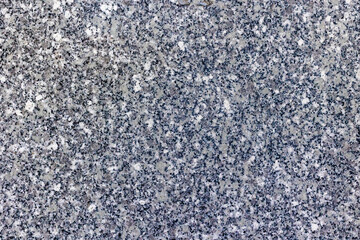 Close-up of speckled granite surface texture with gray and black patterns