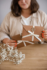 Luxury Gift Card in Bronze Envelope in Female Hands