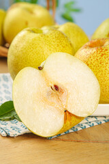 Fresh Dangshan Pears from Anhui China - Crisp Asian Pears with Cross Section on Wooden Table