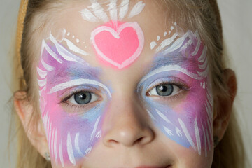 Cute little girl with festival face paint