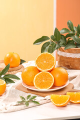 Fresh Orange Citrus Fruits with Sliced Halves on Kitchen Table - Healthy Natural Food Photography