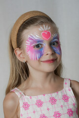 Cute little girl with festival face paint