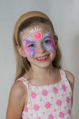 Cute little girl with festival face paint