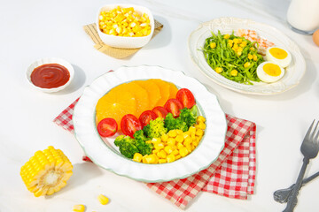 Delicious Fresh Corn and Prawn Salad Bowl with Colorful Vegetables on White Table Setting