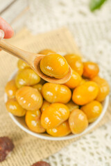 Fresh Golden Chestnuts in Bowl with Wooden Spoon - Healthy Autumn Nuts for Cooking