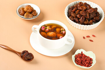Chinese Herbal Tea with Dried Fruits Dates Raisins Goji Berries Traditional Wellness Drink Flat Lay
