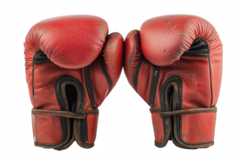Red boxing gloves against a transparent backdrop displaying vintage leather and athletic equipment