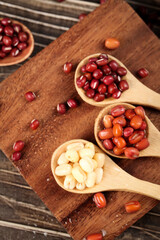 Organic Mixed Beans in Wooden Spoons on Cutting Board - Healthy Legumes and Grains for Cooking
