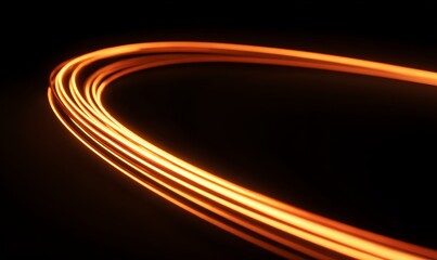 Abstract light trails in motion creating dynamic curved patterns on a black background