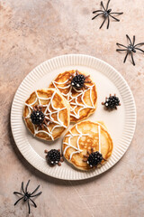 Three spider donuts with blackberries on top