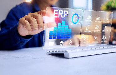 Enterprise resource planning concept or ERP with businessman working on virtual screen to manage factory inventory and manufacturing production plan
