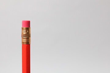 One graphite pencil on grey background, closeup. Space for text