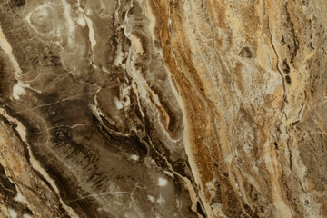 Natural stone surface with intricate patterns and earthy tones showing unique textures and colors