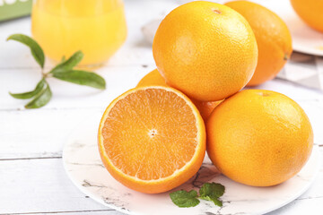 Freshly Picked Orange Citrus Fruit Collection on White Wooden Background