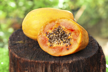 Fresh Red Papaya Fruit Cut in Half on Wooden Stump Hainan Tropical Agriculture