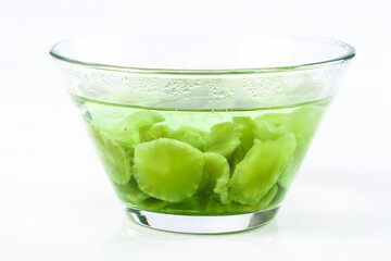 Fresh Green Lettuce Leaves in Glass Bowl with Water for Healthy Salad Preparation