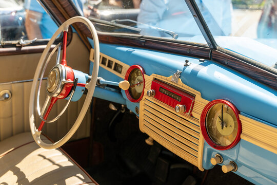 Russia, Sosnovy Bor, July 19, 2025 -Dashboard of vintage russian car gaz m20 pobeda showing steering wheel and radio