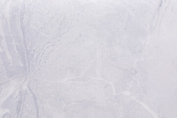 Light gray concrete surface with subtle texture and natural patterns for construction or design projects