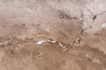 Natural stone texture with intricate patterns and warm tones showcasing beige and brown hues in elegant design