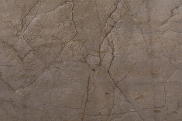 Natural stone texture with cracks and earthy tones found in geological formations