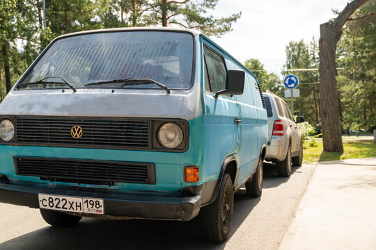 Russia, Sosnovy Bor, July 19, 2025 -Light blue volkswagen t3 van parked on side of road