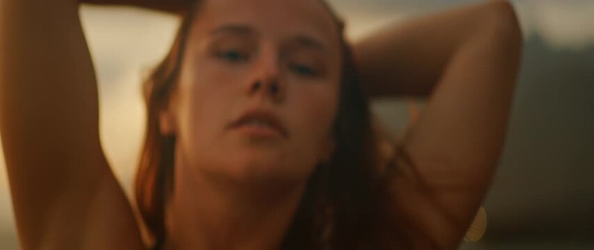 Closeup of woman face during contemporary dance performance in soft sunset light