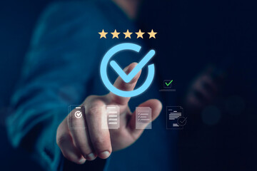 Businessman hand pointing glowing check mark with five stars, symbolizing quality assurance, customer satisfaction, ISO certification, compliance, standard approval, business excellence, and trusted