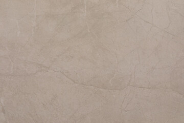 Light beige marble surface with subtle textures and patterns ideal for interior design and decoration projects