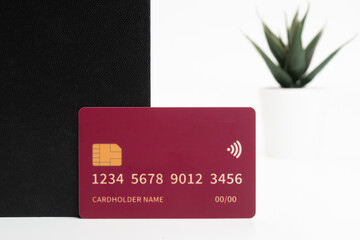 Colorful credit cards on an office desk with supplies. Laying flat. Premium banking and online...